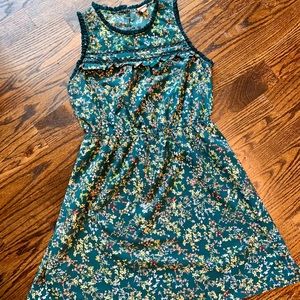 Sleeveless dress with high neck